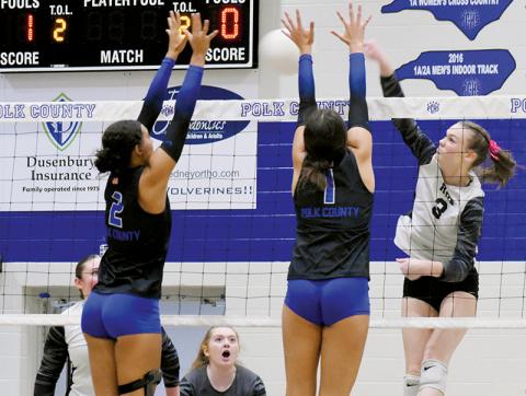 Robbinsville’s three volleyball seniors played their final game as a Lady Knight on Oct. 24, in the second round of the state playoffs. Claire Barlow spikes the ball between Polk County’s Sophia Overholt (2) and Morgan Yoder. Photos by Kevin Hensley/sports@grahamstar.com