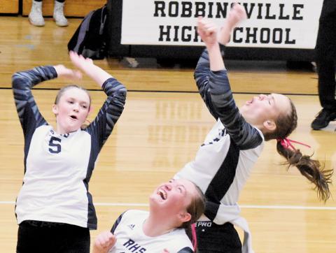 Daphne Barlow, Claire Barlow and Ryn Hooper (clockwise, from top left) celebrate after a block Oct. 10 against Cherokee. Photos by Cheyanne Geyer/The Graham Star