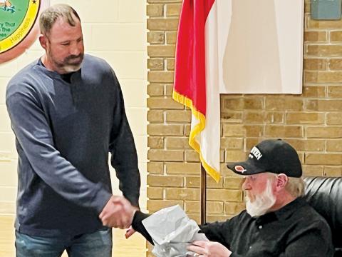 Graham County Board of Commissioners Chairman Jacob Nelms (left) shakes hands with departing  commissioner Keith Eller on Tuesday. Eller did not seek re-election, which made Tuesday his final meeting. Photo by Kevin Hensley/editor@grahamstar.com