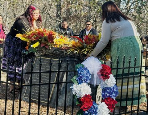 Jenni Junaluska and Cecilia Arrowood lay the ceremonial wreath on Chief Junaluska’s grave to help memorialize the famed Native American on Nov. 13. Jenni is a sixth-generation descendant of the chief. Photos by Latresa Phillips/The Graham Star