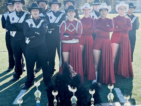 Members of the Robbinsville Black Knights Band pose with the hardware collected at Nov. 2’s Land of the Sky Marching Band Festival, which was held at Enka High School. All names are listed from left in each row. Front row: Rosie Orr, Myley Hyde and Sarai Cervantes. Second row: Jaden Boyle, Sharea Kirkman, Melissa Drouin and  Emily Boyle. Back row: J.T. Hyde, Evan Hood, Dreydon Conley, Murphy Shanahan and Wade Rogers. Photo courtesy of Robbinsville High School Band