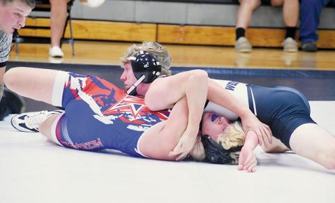 Senior Ethan Webster sprawls out to pin McDowell’s Antonio Molina during Nov. 12’s home dual. Photo by Kevin Hensley/sports@grahamstar.com