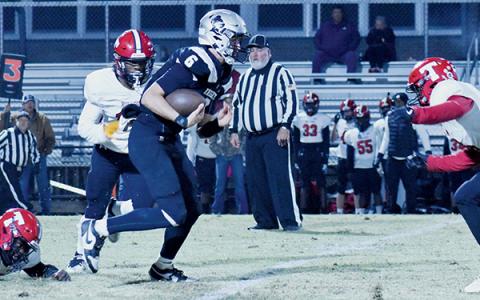 Senior quarterback Bryce Adams finds an opening during Nov. 15’s first-round playoff game against Thomasville. Adams rushed for three touchdowns in the second round Friday, leading the Black Knights past Bessemer City. Photo by Bella Eddings/The Graham Star