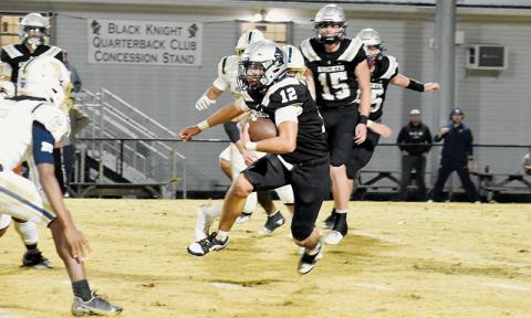 Quinn Jumper (12) eyes a T.C. Roberson defender as he cuts upfield Friday. Photos by Cheyanne Geyer/The Graham Star