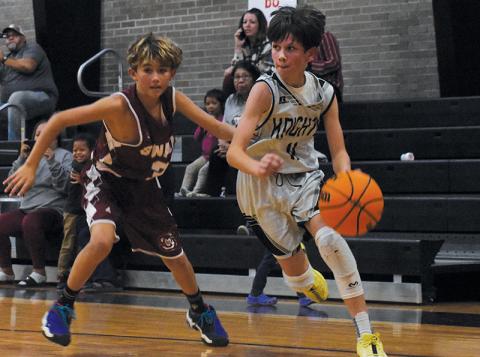 Robbinsville Middle School’s Carsan Snider cuts toward the paint during Nov. 4’s season opener against Swain.