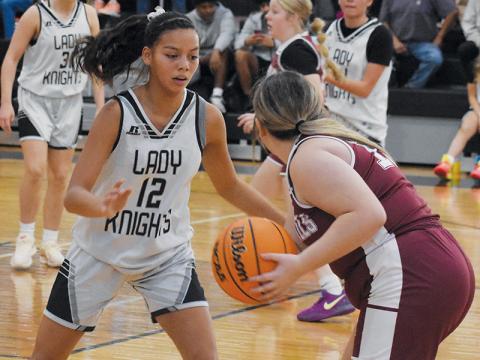Robbinsville’s Aaliyah Wolfe keeps a watchful eye on a Swain County player during Nov. 4’s season opener.