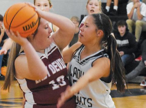 Hazeleigh Driver (right) traps a Swain County ball handler during Monday’s lopsided victory over the Lady Devils. Photo by Cheyanne Geyer/The Graham Star