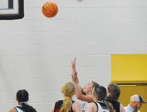 Robbinsville’s Lakin Orr (14) puts up an inside shot during Nov. 21’s home game against Andrews. Photo courtesy of Kyla Garland/Contributing Photographer