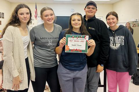 The teams formed for Nov. 14’s inaugural “Smalltown Cupcake Showdown” flexed their creative muscle, both over a stove and when selecting a name for their ensemble. Pictured are the “Gangster Grinches,” which are comprised of (from left): Alexis Miller, Zeyli Williams, Alyssa Bohn, Dreydon Conley and Bella Coats. Photo by Latresa Phillips/The Graham Star