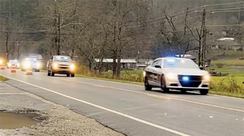 Authorities from multiple regional agencies travel through the Corridor K roadwork in Stecoah for the execution of “Operation Dirty Laundry: Phase 2” on Nov. 26. Photo by Kevin Hensley/editor@grahamstar.com