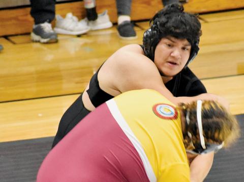 Robbinsville heavyweight Jonah Teesateskie jostles with Cherokee’s Chanttin Tramper on Dec. 18. Photo by Bella Eddings/The Graham Star