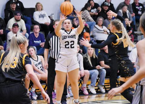 Taking advantage of a frantic scramble inside the paint, Robbinsville senior Jozlyn Garland unloads a 3-pointer Friday against Murphy. Photo by Kyla Garland/The Graham Star