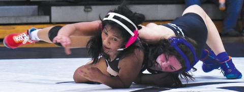 Alexis Miller slams teammate Julia Vazquez during Nov. 7’s scrimmage. Photo by Bella Eddings/The Graham Star