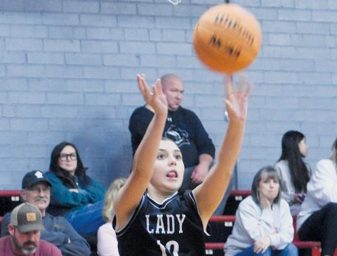 McKynlee Adams launches a long-range jumper Dec. 19 at Andrews. Photo by Kevin Hensley/sports@grahamstar.com