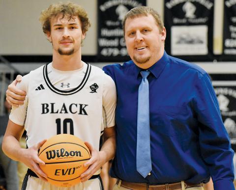 Robbinsville senior Bryce Adams became just the fifth Black Knight in school history to reach the 1,000-point threshold Jan. 8. With Adams is head coach Jake Beasley. Photos by Jacquline Gayosso/The Graham Star