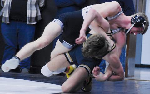 Ethan Webster hooks a half on Hayesville’s Mason Ray during Jan. 9’s Smoky Mountain Conference duals. Despite the bout being halted twice to plug a bloody nose, Webster scored a 20-5 technical fall and went 4-0 on the evening. Photo by Kevin Hensley/sports@grahamstar.com