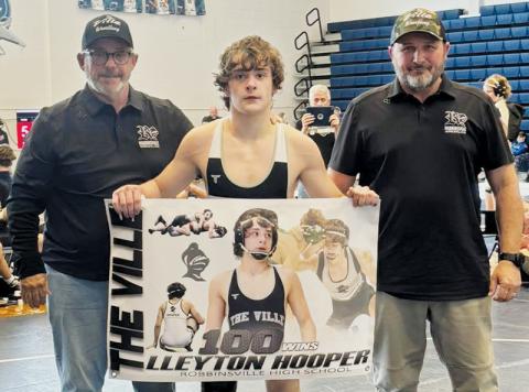Black Knight Lleyton Hooper secured his 100th career win at Saturday’s Enka Duals. With Hooper is assistant coach David Haney (left) and head coach Travis Hooper. Photos courtesy of Robbinsville Wrestling