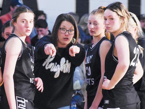 Brooke Cox, Ella Nelms and Myah Winfrey (from left) listen intently as Robbinsville head coach Brittany Snider sets up a play during a late timeout Jan. 15 at Hayesville. Photos by Kevin Hensley/sports@grahamstar.com