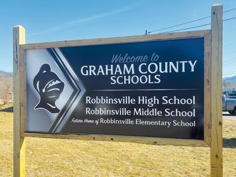 This newly-installed sign sits at the intersection of Black Knight Drive and U.S. 129 (Rodney Orr Bypass), directing travelers to the “new” entrance to both Robbinsville Middle and High schools. The intersection opened in November 2019 – and as the sign indicates, more expansion is in the works, as the intersection will become a busy hub in Robbinsville once the new elementary school is constructed. Photo courtesy of Robert Moody/Graham County Schools