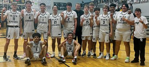 The Smoky Mountain Conference title returned to the Black Knights on Tuesday, following a victory over Cherokee. Standing in back (from left) are Nathan Frederick, Roman Jones, Kenyon Swimmer, Quinn Jumper, Isiac Collins, head coach Jake Beasley, Dane Knott, Kasen Buchanan, Trey Lambert, Luke Lovin, Kyzik Teesateskie, Logan  Callaway and manager Joshua Satterfield. Sitting in front are Darion Ledbetter (left) and Bryce Adams. Photo by Kevin Hensley/sports@grahamstar.com