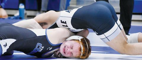 Adair Panama puts Polk County’s Liam Jackson in a world of hurt during the Feb. 5 third-round, dual-team  postseason match. Robbinsville won the dual, but fell in the regional final to Mount Airy. Photos by Kensie Belk/The Graham Star