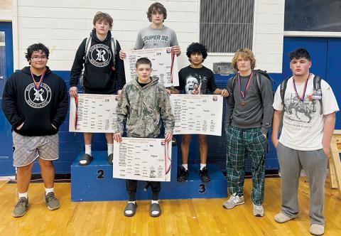 Robbinsville wrestling’s seven state qualifiers stand proudly at the conclusion of the 1A Western Regional tournament Saturday. From left are Jonah Teesateskie, Loxston Hooper, Skyler Anderson, Lleyton Hooper, Adair Panama, Devin Hall and Kellen Ensley. Photo courtesy of Brooke Haney/Robbinsville Wrestling