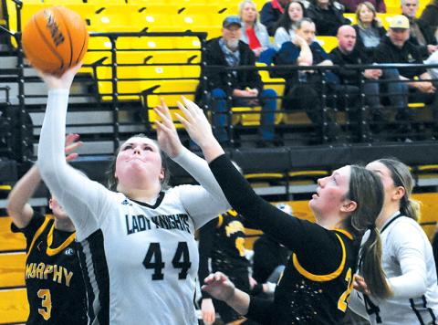 Bentley Riggins stretches for a second-half layup in Saturday’s conference-tournament opener against Murphy. Photos by Kevin Hensley/sports@grahamstar.com
