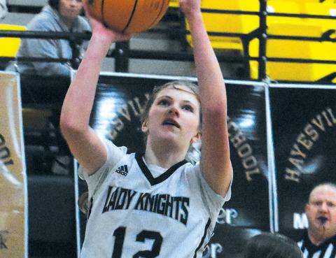 Lady Knights freshman Zaelyn Phillips evades Murphy’s Cayla Geer for a lay-up attempt during Feb. 15’s conference-tournament quarterfinal. Photo by Kevin Hensley/sports@grahamstar.com