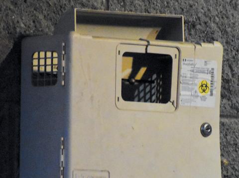 This sharps container at a local playground was allegedly broken into March 9, with used needles from the box left scattered on the ground. Photo by Kevin Hensley/editor@grahamstar.com