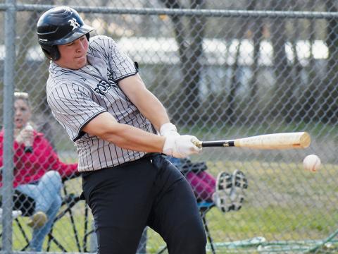 Dayne Webster drives the ball March 25 against Hiwassee Dam. Photo by Bella Eddings/The Graham Star