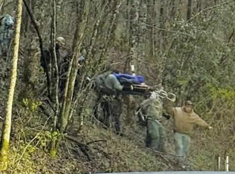 Rescuers descend off the Appalachian Trail with an injured hiker at Yellow Creek Gap on Friday. 