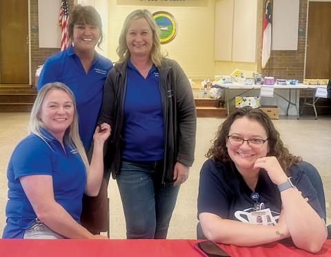 Members of the Graham County Department of Public Health helped with a mobile pharmacy visit Friday.  Seated in front are Jessica Yates (left) and Rosie  Roessler. Standing in back are director Donna Stephens (left) and Shawn Turpin. Photo by Latresa Phillips/The Graham Star