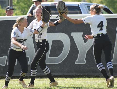 Lexie Williams, Sydney Adams and Anna Williams (from left) complete their outfield warm-ups in a unique manner prior to Tuesday's first-round playoff game against Mitchell. Photo by Lexie Anderson/The Graham Star