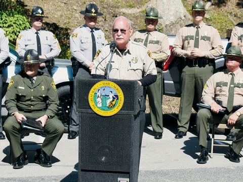 Curtis Cochran speaks at the Border-to-Border Tail of the Dragon Program Launch, which was held at Deals Gap Motorcycle Resort on June 13, 2023. Cochran was suspended from his duties as Swain County Sheriff on Friday, following his arrest in connection to alleged, recent sexual misconduct. Photo by Kevin Hensley/editor@grahamstar.com