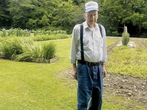Even at the age of 87, James Crisp works with his wife Sara to raise a garden each year that catches the eye of anyone who turns onto Mill Creek Circle. Photo by Latresa Phillips/The Graham Star