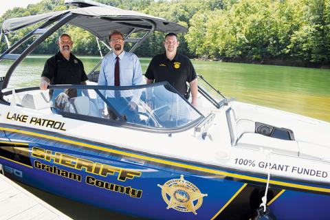 A new search and rescue boat – for use in both Graham and Swain counties – was unveiled on the shores of Fontana Lake on Aug. 14. From left are Graham County Sheriff Brad Hoxit; U.S. Rep. Chuck Edwards (R-Hendersonville), who helped obtain the funding to purchase the boat; and Swain County Sheriff Brian Kirkland. Photo by Kevin Hensley/editor@grahamstar.com