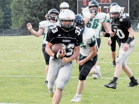 Kreed Williams rushes into the end zone to wrap up a 16-0 shutout of the Mountain Heritage Cougars during Aug. 21’s JV season opener. Photo by Lexie Anderson/The Graham Star