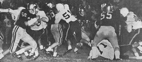 In this photo from the front page of the Sept. 25, 1970 edition of The Graham Star, Ronnie Waldroup (right) begins an eight-yard run in the Smoky Mountain Conference title game against Hayesville, thanks to a hole opened up by offensive linemen Roger Anderson (71) and Barry Millsaps (51).