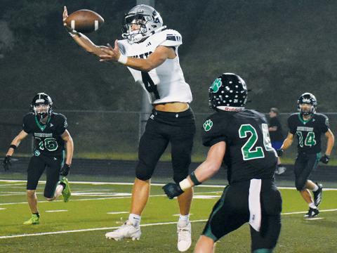 Cameron Allison reels in a one-handed reception for a big gain during Friday’s game at Mountain Heritage. Allison finished the night with 139 receiving yards. Photo by Kevin Hensley/sports@grahamstar.com