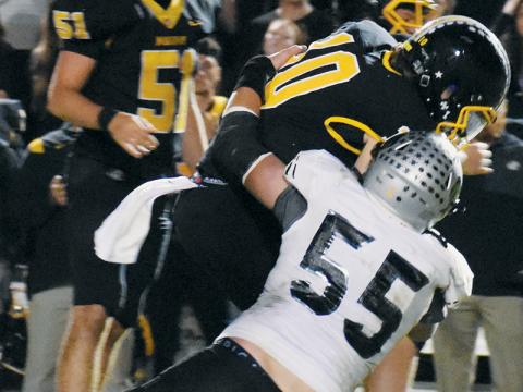Kasen Buchanan (55) sacks Murphy quarterback Brady Grant to end the first half of action Friday. Photos by Kevin Hensley/sports@grahamstar.com