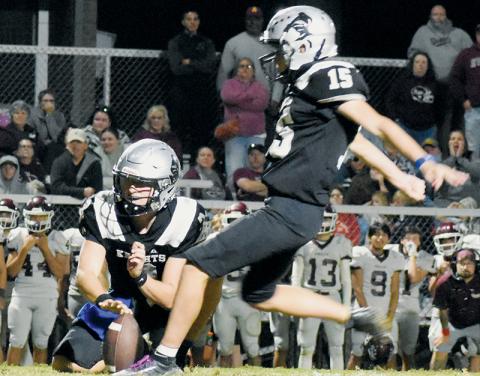 With Luke Lovin serving as placeholder, Robbinsville’s Zander Lucksavage prepares to boot what proved to be the game-winning field goal Friday against Swain County. Lucksavage split the uprights as the final buzzer sounded at Modeal Walsh Memorial Stadium. Photo by Kevin Hensley/sports@grahamstar.com