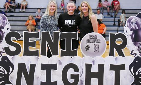 Prior to Tuesday's varsity match against Swain County, Robbinsville High School volleyball recognized its lone senior: Ryn Hooper. With Hooper is assistant coach Kensley Hamilton (left) and head coach Kadey Jones. Photos by Kevin Hensley/sports@grahamstar.com