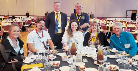 Robbinsville native Haylee Van Deusen (seated, center) is shown surrounded by friends and loved ones prior to receiving the NCWorks Governor's Young Adult Award for Distinction at a ceremony in Greensboro last month.