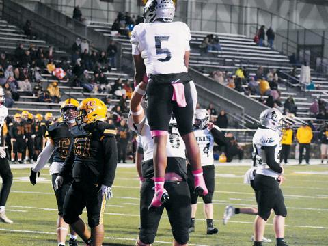 Robbinsville’s Dane Daniels (76) provides some free air time for Kyzik Teesateskie on Friday, after the latter scored his second rushing touchdown at Cherokee. The senior running back leads the Black Knights with 12 touchdowns and enters the postseason with 571 yards on the ground in 2025. Photo by Kevin Hensley/sports@grahamstar.com