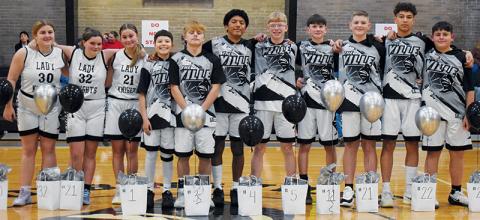 In-between games Dec. 18, Robbinsville Middle School recognized its eighth-grade basketball players. From left are Lady Knights Parklyn Anderson, Calin Gladden, Lakin Orr and Black Knights Kamden Driver, Brayden Allison, David Guzman, Landon Silvers, Carsan Snider, Micah York, Jaxon Blundell and Channing Jones.