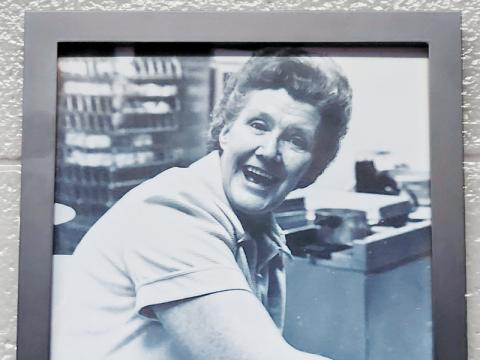 This photo of Nan Hill sits inside the Robbinsville Elementary School Cafeteria as a tribute to the former lunchroom worker. A new fund has been set up to help assist students with food purchases in her honor.