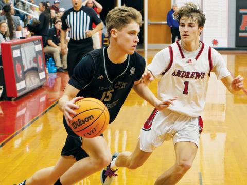 Dane Knott attempts to drive past Andrews’ Gabe Clark during Friday’s conference opener. Knott had a team-best 26 points in Robbinsville’s win over the Wildcats. Photo by Cannon Crompton/Cherokee Scout