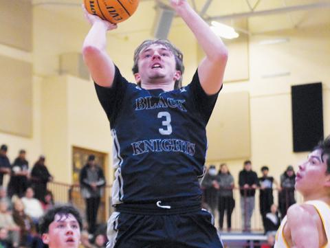 Black Knights point guard Luke Lovin splits a pair of Cherokee defenders, who can only look on in  amazement as the senior glides through the air for a basket attempt during Friday's conference road game. Photo by Kevin Hensley/sports@grahamstar.com
