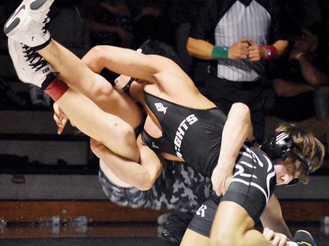 Adair Panama takes down Tuscola's David Levi Wood during the 120-pound finals of Saturday's James Orr Invitational. Photos by Bella Eddings/The Graham Star