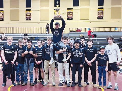 The Robbinsville Black Knights gather with the 2025-26 Smoky Mountain Conference Traditional Tournament championship trophy, which they won Jan. 22 at Cherokee. Photo courtesy of Robbinsville Wrestling